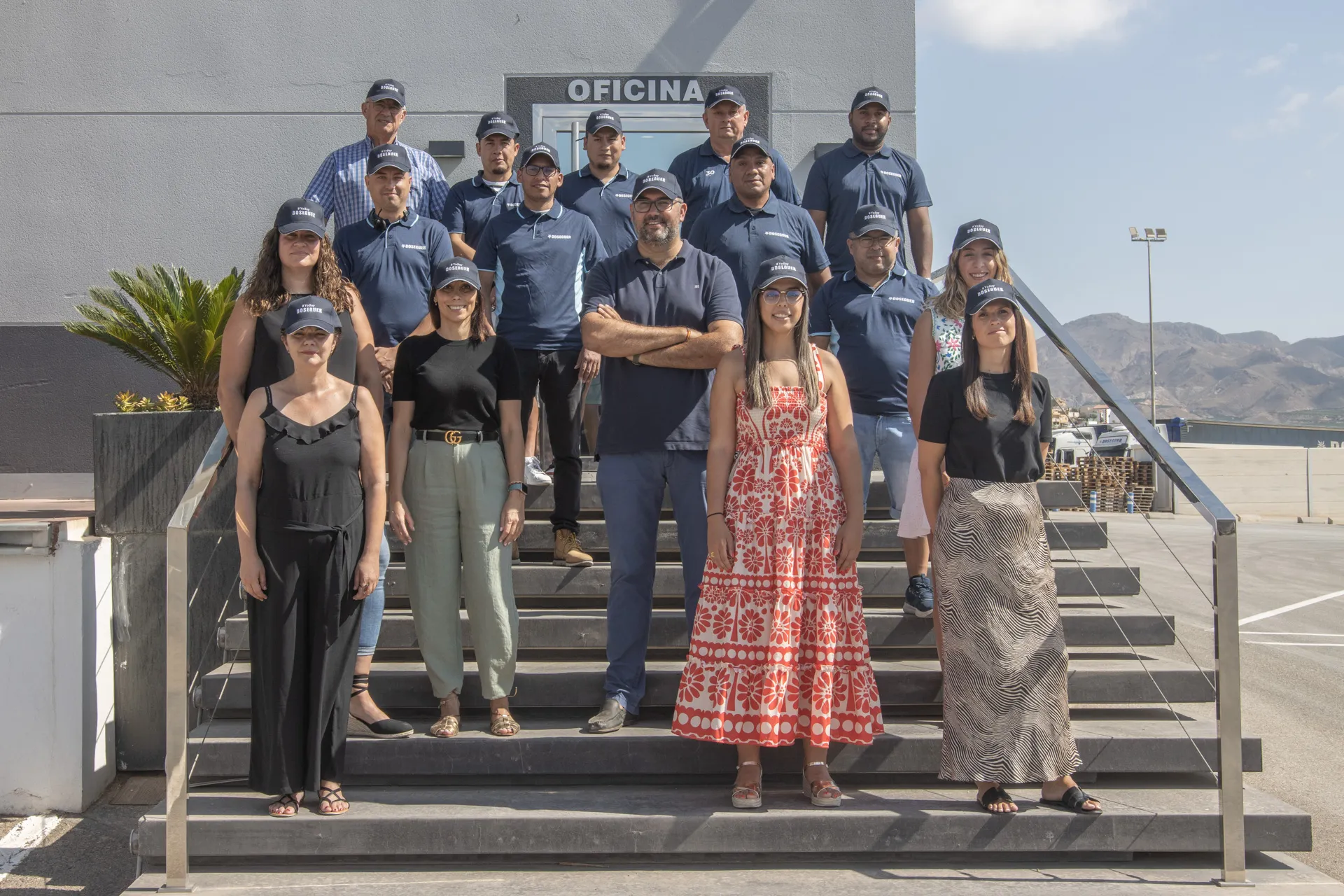 Doseguer team in front of its facilities